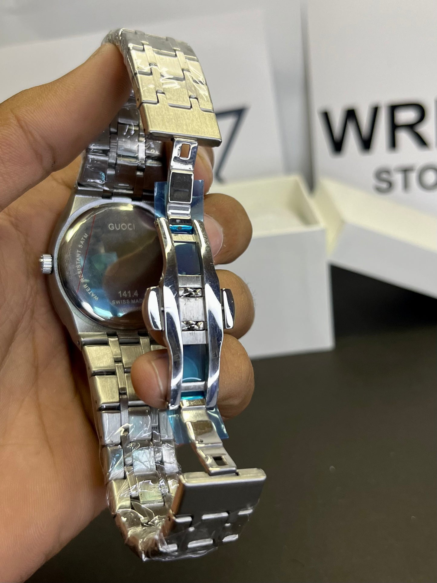 Gucci silver with green dial