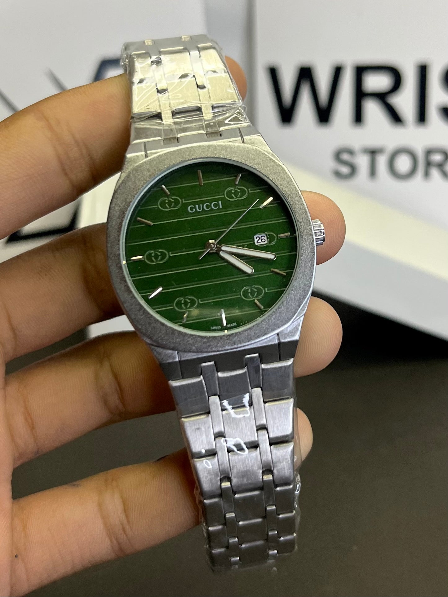 Gucci silver with green dial