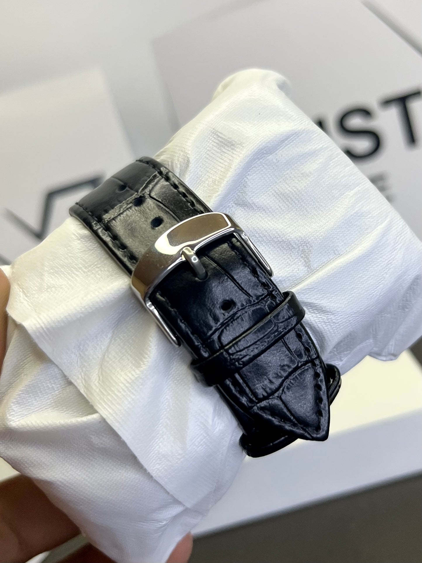 Cartier Tank watch with black dial